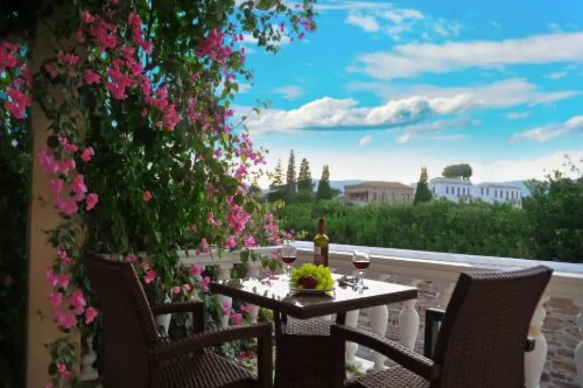 Bougainvillea-covered balcony overlooking Kampos at Voulamandis House, Chios